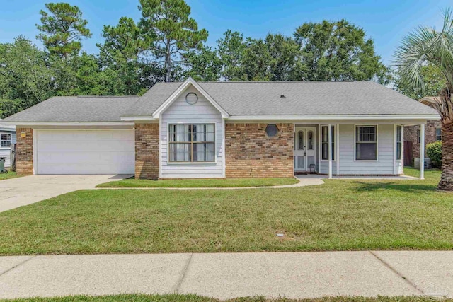 ranch-style home with a garage and a front lawn