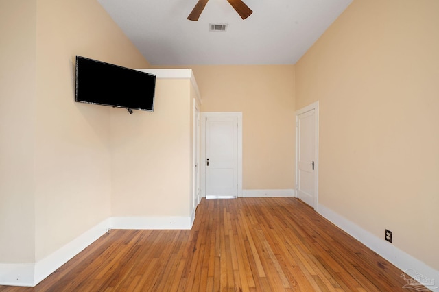 spare room with wood-type flooring and ceiling fan