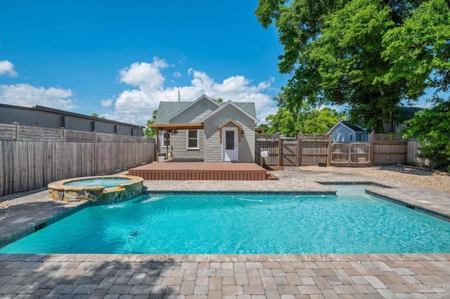 view of swimming pool featuring an in ground hot tub and pool water feature