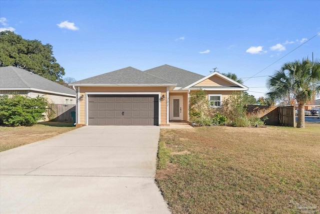 single story home featuring a garage and a front lawn