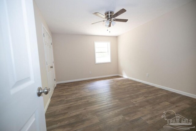 empty room with hardwood / wood-style flooring and ceiling fan