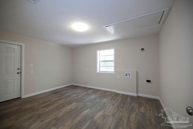 unfurnished room featuring a textured ceiling and hardwood / wood-style floors