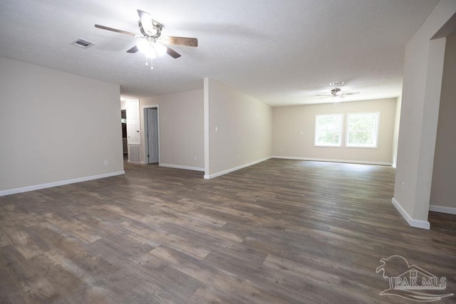 spare room featuring ceiling fan and dark hardwood / wood-style flooring