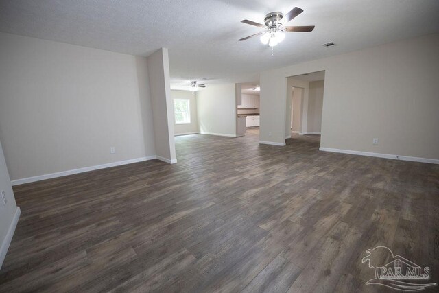 spare room featuring a textured ceiling, ceiling fan, and hardwood / wood-style floors