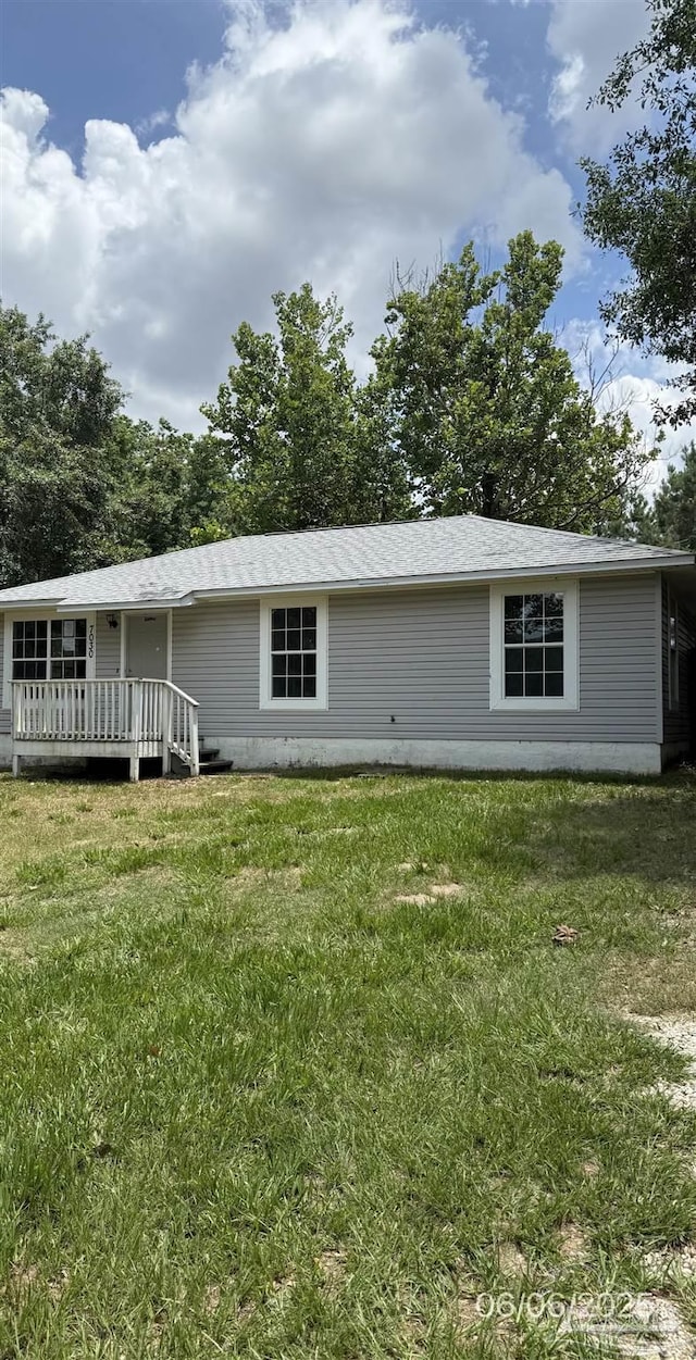 7030 Mcelhaney Rd, Century, FL 32535 - view of front of house featuring a front lawn and a deck
