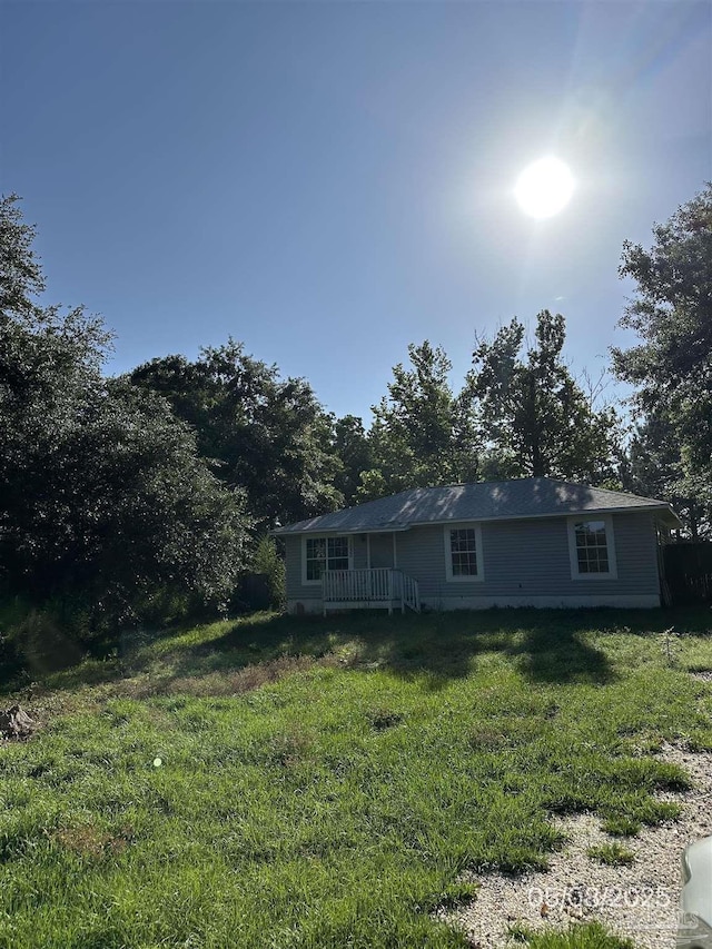 7030 Mcelhaney Rd, Century, FL 32535 - rear view of property with a lawn and a wooden deck
