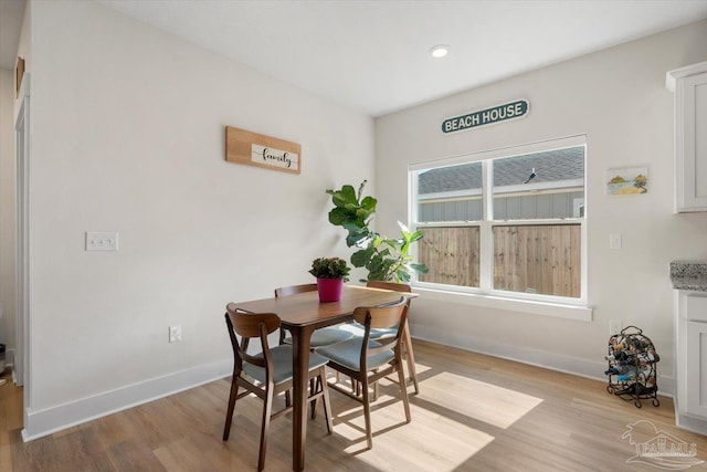 dining room with light hardwood / wood-style flooring