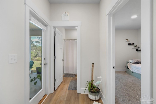 corridor featuring light hardwood / wood-style flooring