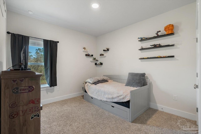 bedroom with light colored carpet