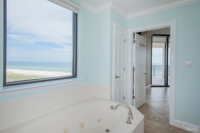 bathroom featuring a tub to relax in, ornamental molding, a water view, and tile patterned flooring