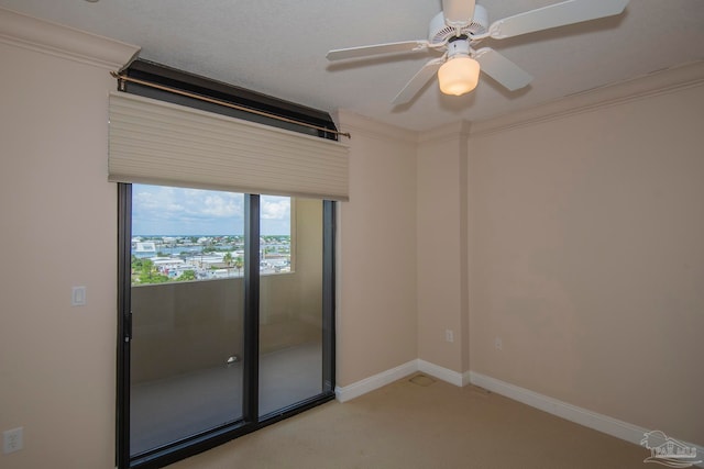 unfurnished room with ceiling fan and light carpet