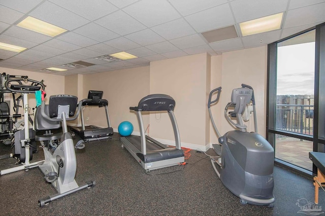 exercise room with a drop ceiling