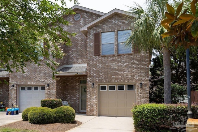 8868 Sanderling Ln, Navarre, FL 32566 - view of front of house with an attached garage, concrete driveway, and brick siding