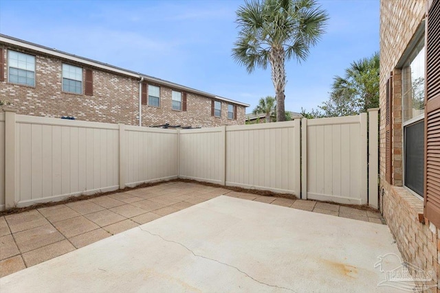 8868 Sanderling Ln, Navarre, FL 32566 - fenced backyard featuring a patio area
