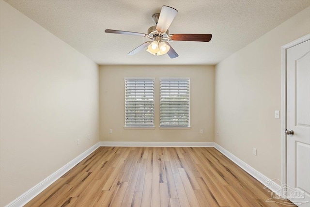 8868 Sanderling Ln, Navarre, FL 32566 - spare room with light wood-type flooring, ceiling fan, baseboards, and a textured ceiling