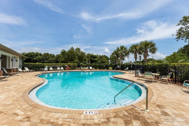 8868 Sanderling Ln, Navarre, FL 32566 - community pool with a patio area