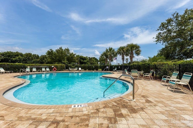 8868 Sanderling Ln, Navarre, FL 32566 - community pool featuring a patio area