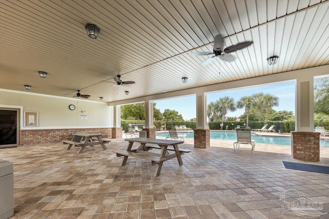 8868 Sanderling Ln, Navarre, FL 32566 - view of patio / terrace featuring ceiling fan and a community pool