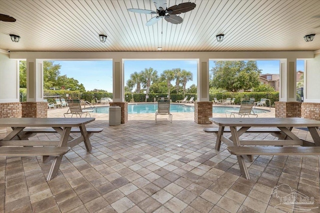 8868 Sanderling Ln, Navarre, FL 32566 - view of patio / terrace featuring ceiling fan and a community pool