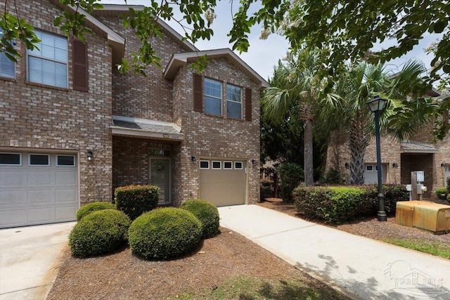 8868 Sanderling Ln, Navarre, FL 32566 - traditional-style house with concrete driveway, a garage, and brick siding