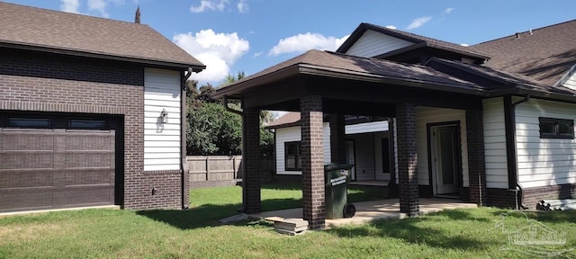 view of home's exterior featuring a yard and a garage