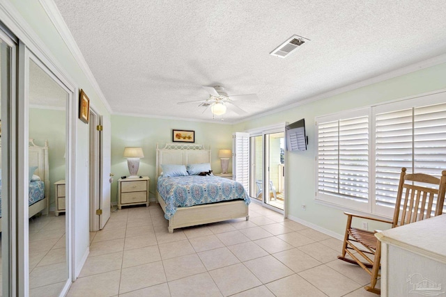 1650 Bulevar Menor, Pensacola Beach, FL 32561 - bedroom with ornamental molding, access to exterior, a textured ceiling, and visible vents