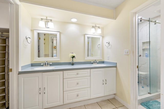 1650 Bulevar Menor, Pensacola Beach, FL 32561 - bathroom with double vanity, a sink, tile patterned flooring, and a stall shower
