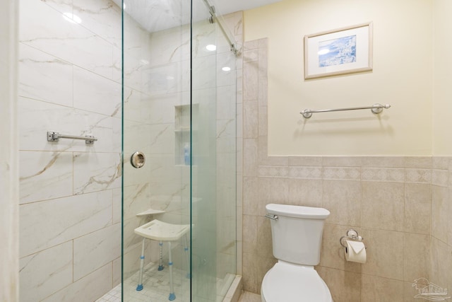 1650 Bulevar Menor, Pensacola Beach, FL 32561 - full bathroom featuring toilet, tile walls, wainscoting, and a stall shower