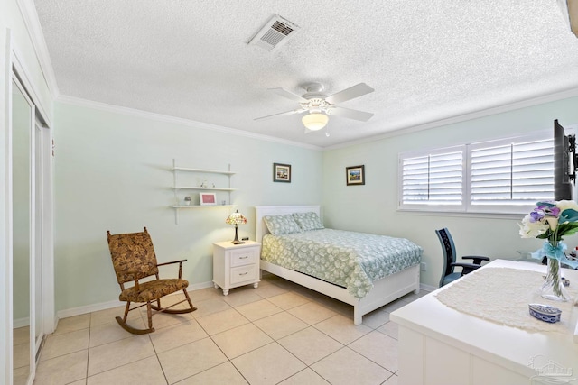 1650 Bulevar Menor, Pensacola Beach, FL 32561 - bedroom with visible vents, a textured ceiling, crown molding, and light tile patterned floors