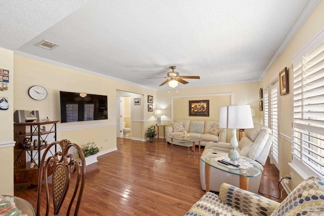 1650 Bulevar Menor, Pensacola Beach, FL 32561 - living area with visible vents, a ceiling fan, a textured ceiling, and wood finished floors