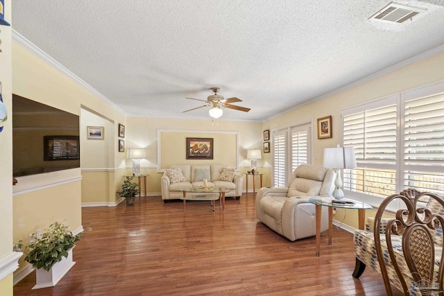 1650 Bulevar Menor, Pensacola Beach, FL 32561 - living area featuring ornamental molding, a textured ceiling, ceiling fan, and wood finished floors