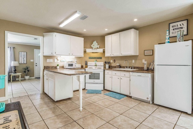 kitchen with white appliances, sink, white cabinetry, extractor fan, and light tile patterned floors