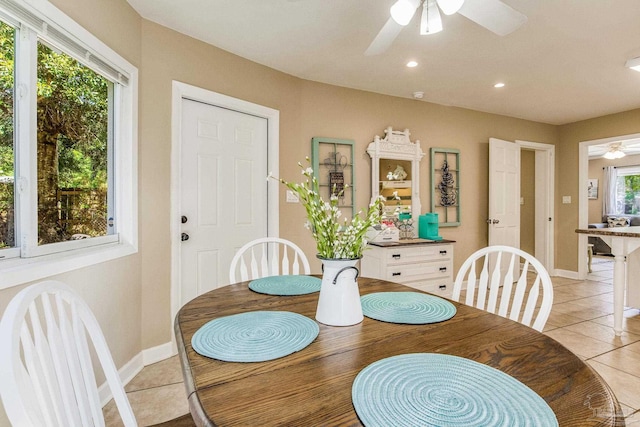 dining area featuring ceiling fan and light tile patterned floors