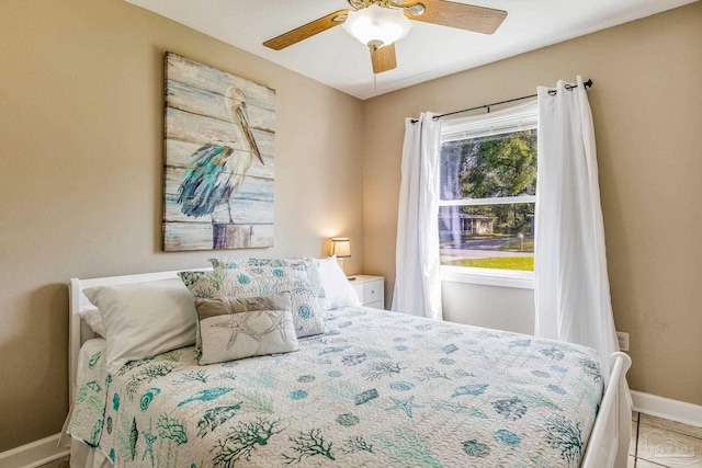 bedroom with tile patterned flooring and ceiling fan