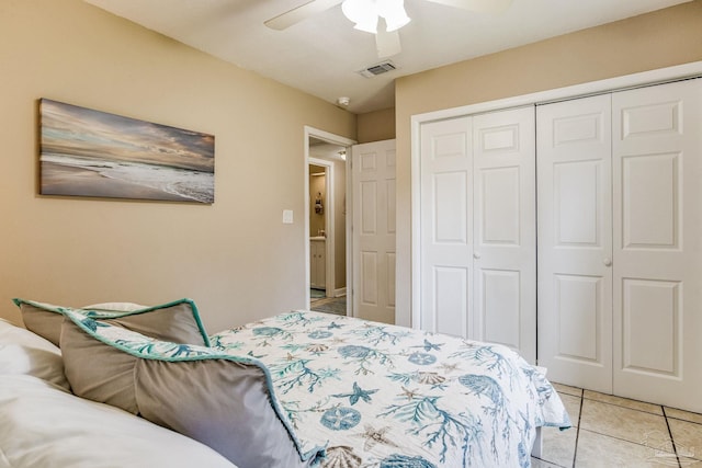 tiled bedroom featuring a closet and ceiling fan