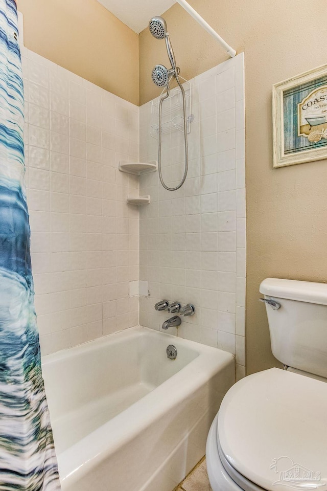 bathroom featuring toilet and shower / bath combo with shower curtain