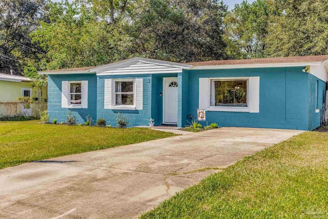 ranch-style home with a front yard