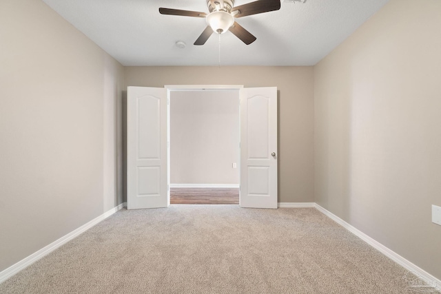 unfurnished bedroom featuring carpet flooring and ceiling fan