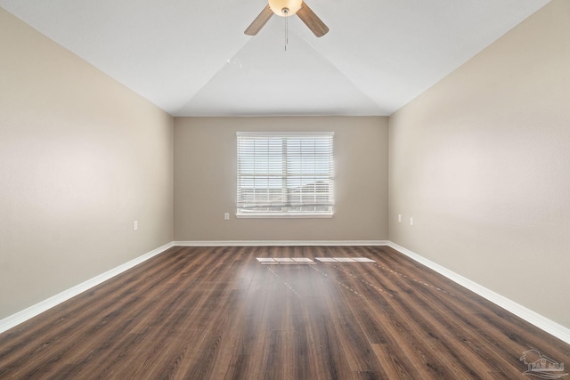 unfurnished room with dark hardwood / wood-style floors, vaulted ceiling, and ceiling fan