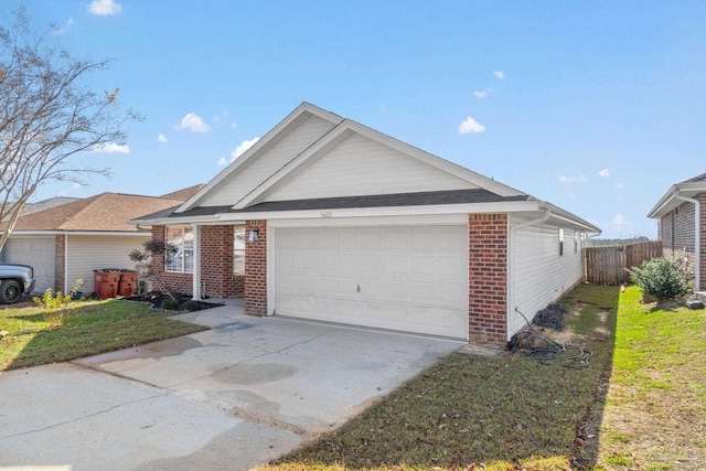 single story home featuring a garage and a front lawn