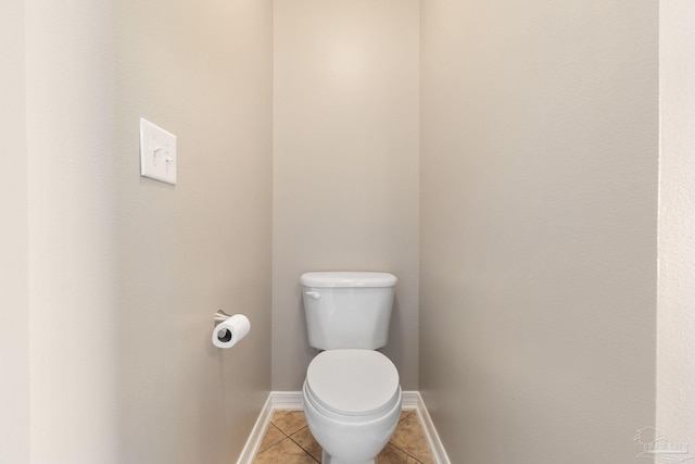 bathroom with tile patterned floors and toilet