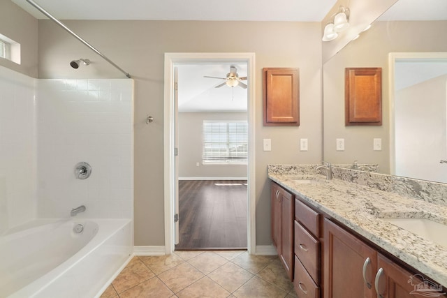 bathroom with wood-type flooring, vanity, ceiling fan, and tub / shower combination