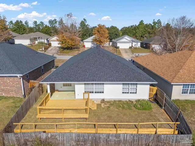 back of property featuring a deck