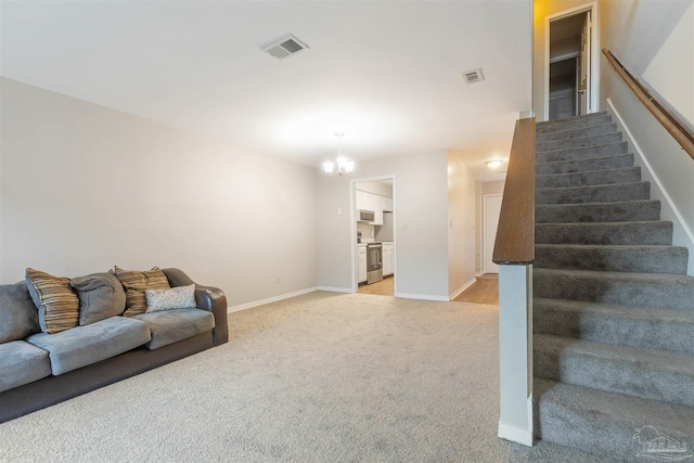 living room featuring light carpet and a notable chandelier