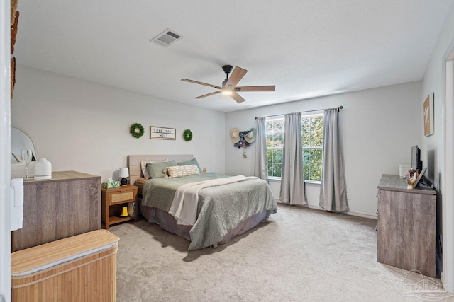 carpeted bedroom featuring ceiling fan