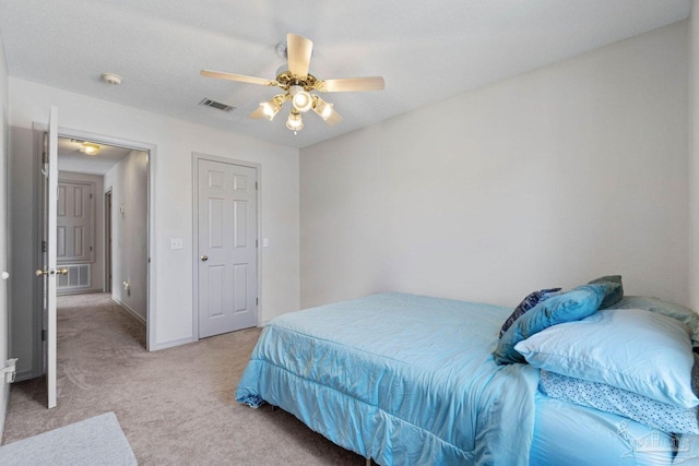 carpeted bedroom with ceiling fan