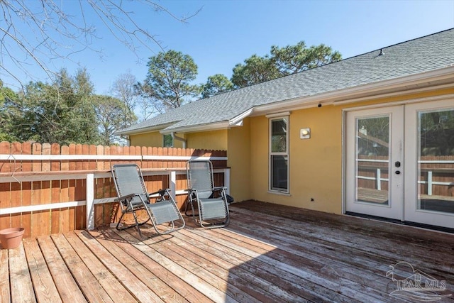 wooden terrace with french doors and fence