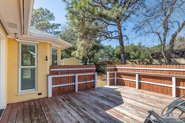 wooden deck featuring fence