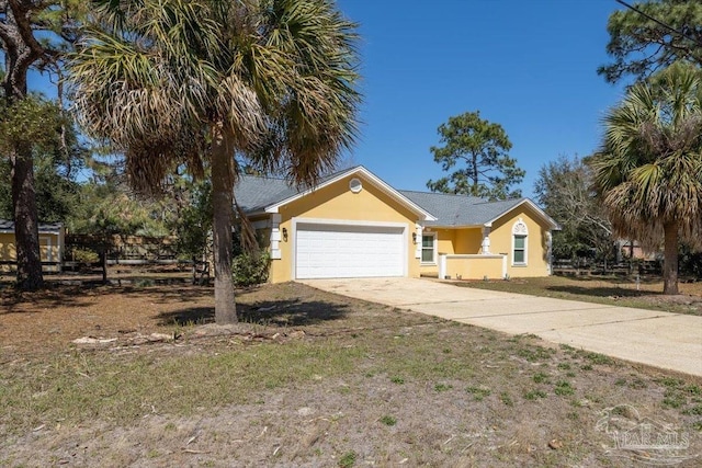 ranch-style home with stucco siding, driveway, and a garage