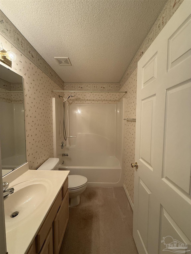 full bathroom with vanity, shower / bathing tub combination, a textured ceiling, and toilet